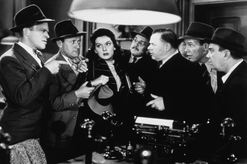 L. to R. : Frank Jenks, Roscoe Karns, Rosalind Russell, Porter Hall, Gene Lockhart, Regis Toomey &amp; Cliff Edwards in His Girl Friday (1940)